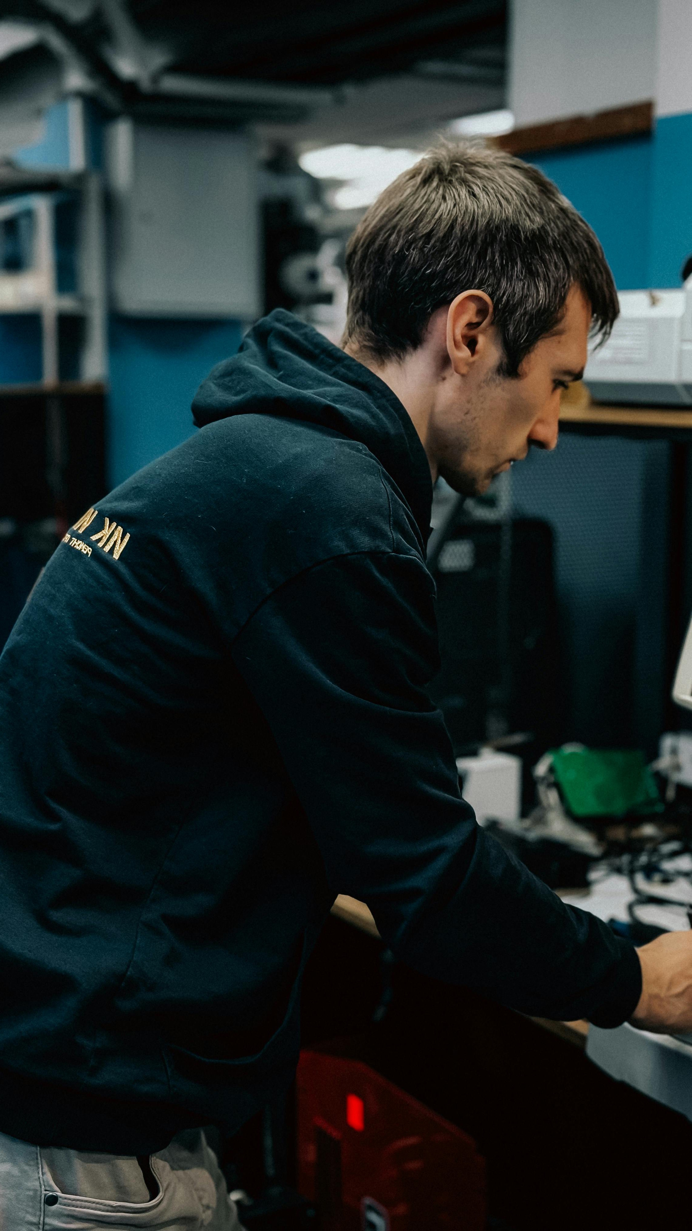 Technician working carefully in a repair workshop